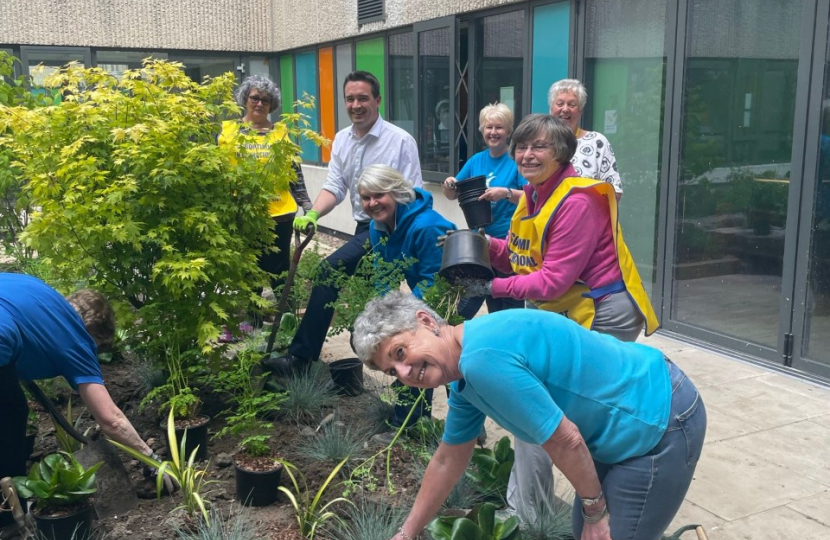 MP helps plant tree at hospital 'quiet area'  